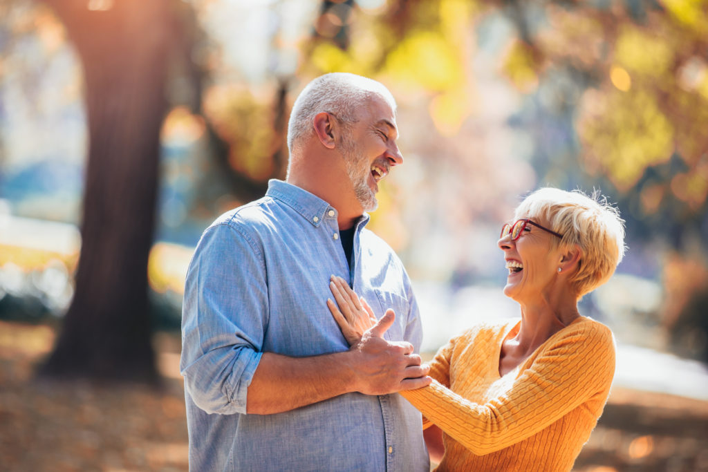Active seniors on a walk in forest